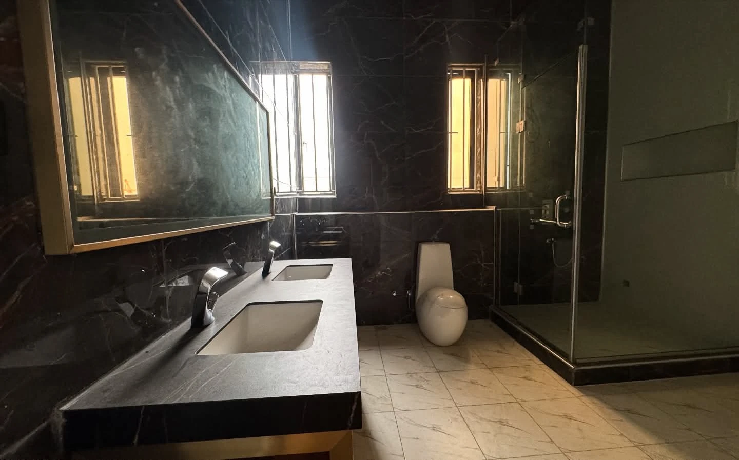 Double vanity sink black marble bathroom